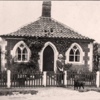 Lady and her dog outside a lodge at Salle